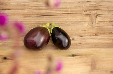 Eggplants on rustic wooden background