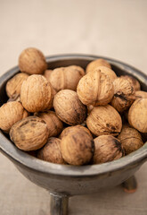 Walnuts on light textile background