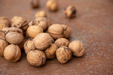 Walnuts on rustic plate at Autumn