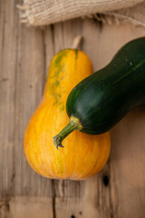 Ripe Pumpkins In rustic wooden table At Sunset