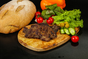Roasted pork liver steak isolated