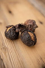 Walnuts on rustic wooden table at Autumn
