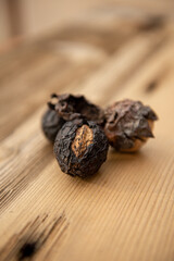 Walnuts on rustic wooden table at Autumn