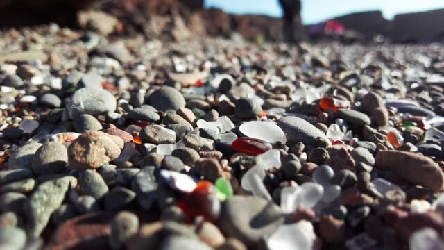 Aerial: Pebbles and stones on Glass Beach at Fort Bragg on Mendocino Coastline, California, USA