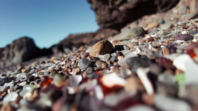 Aerial: Pebbles and stones on Glass Beach at Fort Bragg on Mendocino Coastline, California, USA