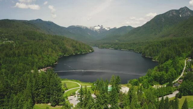 Stunning aerial view of the mountain landscape around scenic Capilano Lake in British Columbia.