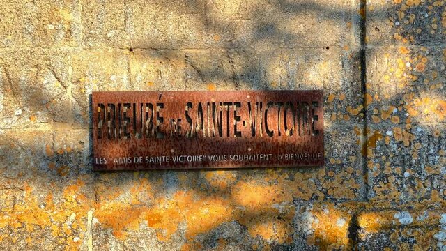 "Prieur&eacute; Sainte-Victoire, the friends of Sainte-Victoire welcome you" french sign on the wall of the Priory of Sainte-Victoire