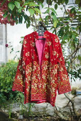 12-3-21, Jambi Indonesian : traditional dress for the groom. red and gold.