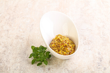 Grain mustard sauce in the bowl