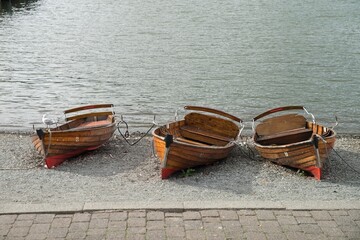 Three wooden boats on the shore