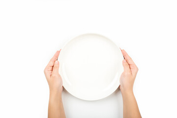 Woman holding empty plate waiting for food, isolated on white background, top view, copy space