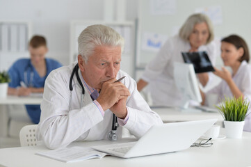 Fototapeta premium Portrait of a senior doctor working at hospital