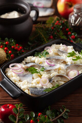Herring fillet salad in cream with apple.