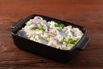 Herring fillet salad in cream with apple.