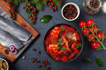 Herring fillet salad in tomato sauce.