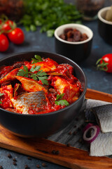 Herring fillet salad in tomato sauce.