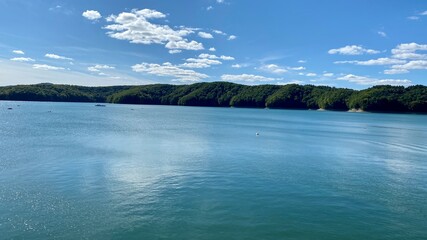 Lake Solinskie on a sunny day blue sky in the distance of the Bieszczady Mountains