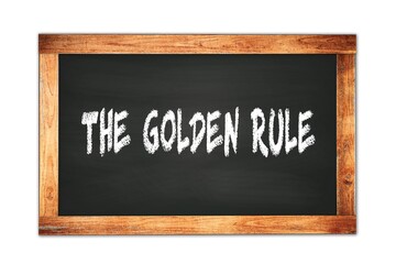 THE  GOLDEN  RULE text written on wooden frame school blackboard.