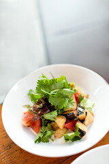 home cuisine of a restaurant level. ready-made presentation of the dish. Green salad with parsley and eggplant in Georgian style