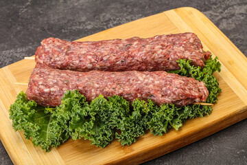 Raw minced beef kebab skewer