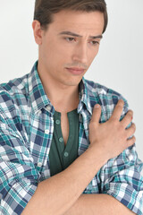 handsome young man thinking in studio