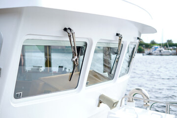 Close up of the windows and wipers of a modern, white boat - obrazy, fototapety, plakaty