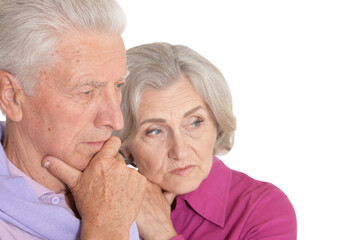 Sad senior couple isolated on white background