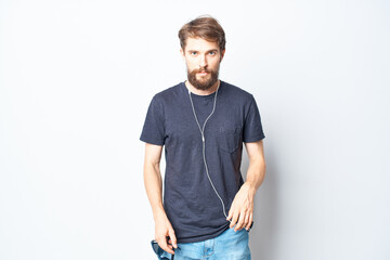 Fototapeta premium bearded man headphones sunglasses music dance fun light background