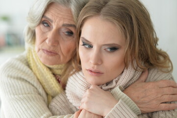 Portrait of sad  Senior woman with daughter