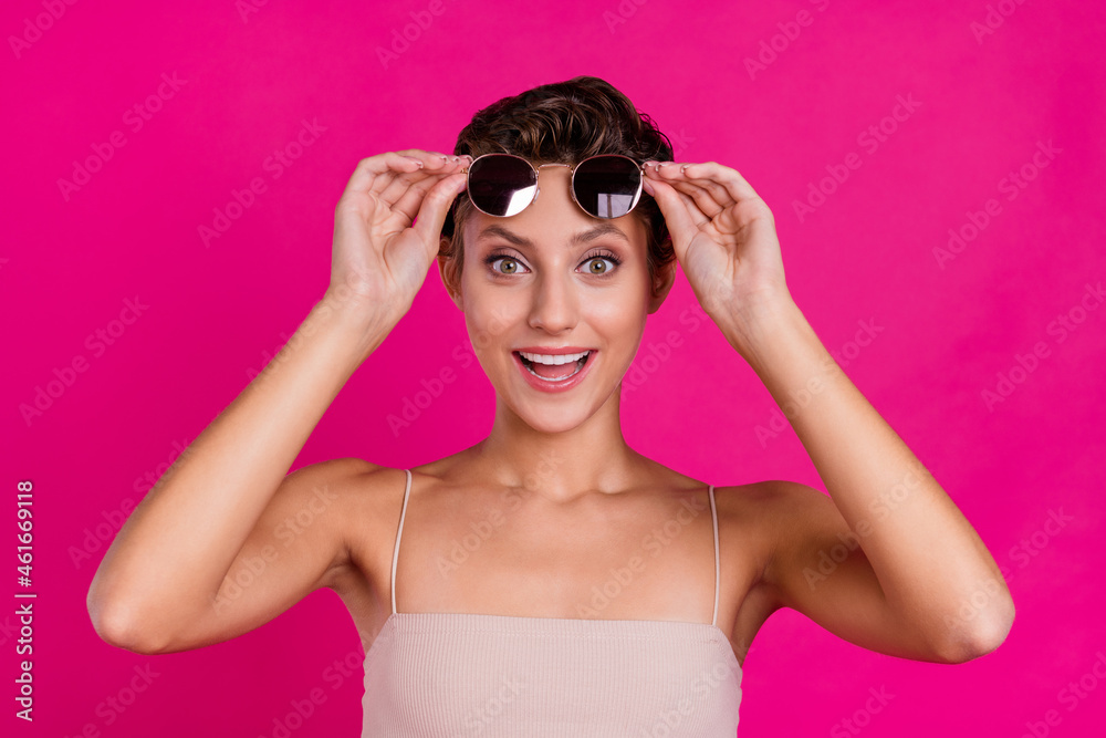 Wall mural Photo of amazed shocked cool cheerful young lady good mood news isolated on magenta color background