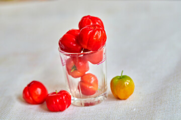 closeup the spanish cherry ripe in glass cup on white background