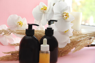 spa treatments. Oil for massage. Jars of shampoo and balm. Jars for brown cosmetics with a dispenser.