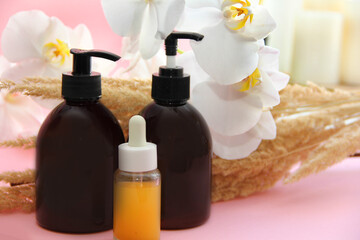 spa treatments. Oil for massage. Jars of shampoo and balm. Jars for brown cosmetics with a dispenser.