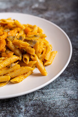 Pasta with pumpkin and mushrooms, a complete vegetarian dish. Ideal for an autumn lunch