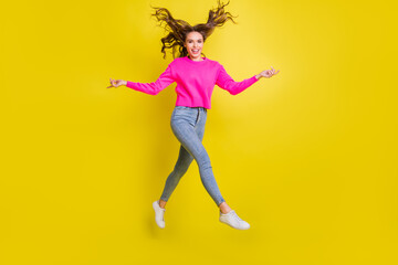 Fototapeta na wymiar Full length profile size photo of young attractive girl happy positive smile go walk step jump isolated over yellow color background