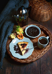 Evening tea with jam and a piece of cake. The cozy atmosphere of the cafe helps to relax and relax in silence.