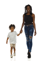 African mother and her son are walking together towards camera. Front view, isolated. - 461674789