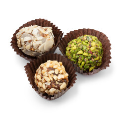 Sweet Turkisch date bonbons decorated with nuts isolated on white background 