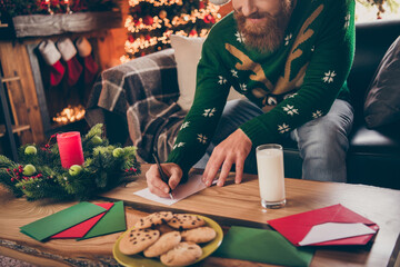 Cropped view portrait of attractive guy writing mail congrats december winter time at modern loft industrial style indoors