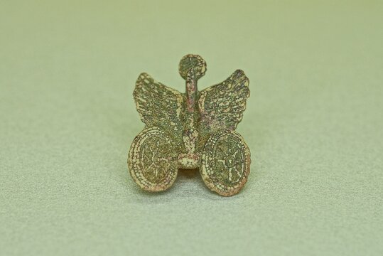 one small green old soviet army buttonhole on the gray table