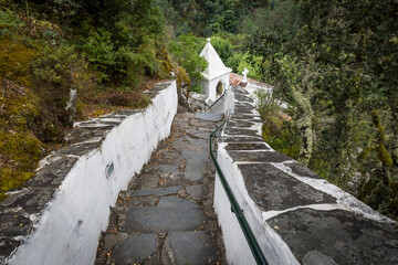 stone staircase going down to the Chapel of Senhor da Agonia at the Natural and landscaped complex of Our Lady of Mercy, Lousa, Portugal