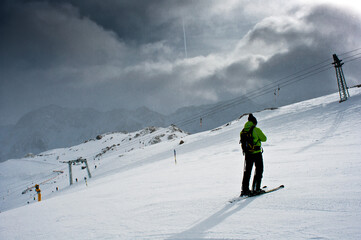 Fototapeta na wymiar A skier drives down the piste