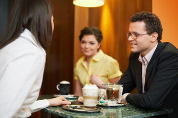 Business people talking at table in coffee shop