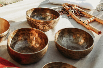 Tibetan bowls and flute equipment for sound therapy and musical meditation in the forest