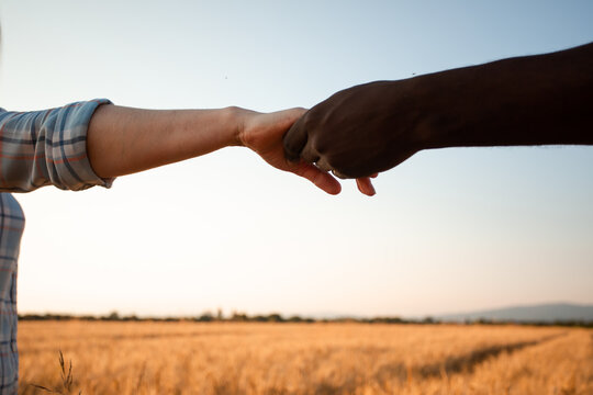 Diverse culture concept. Black man and white woman hands - Powered by Adobe