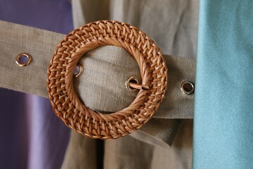 Close up of natural clothing belt on linen fabric