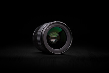 Photography Photo Lens.  Ecstatic photo camera lens in a dark ambience