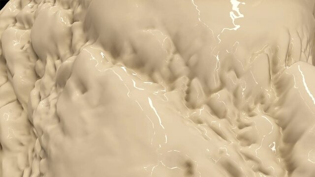 Waves of creamy liquid texture move and reflect light