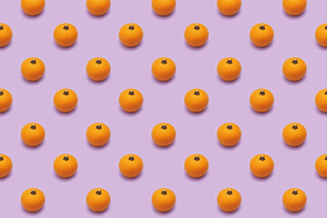 pattern with pumpkins on violet background