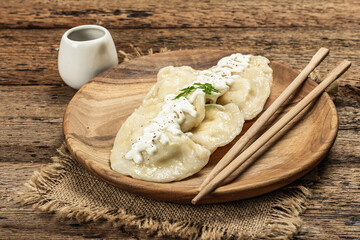 Traditional Dumplings with soy sauce. Traditional Oriental cuisine